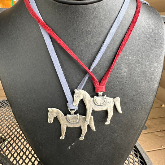 Necklace with horse pendants on a leather chain
